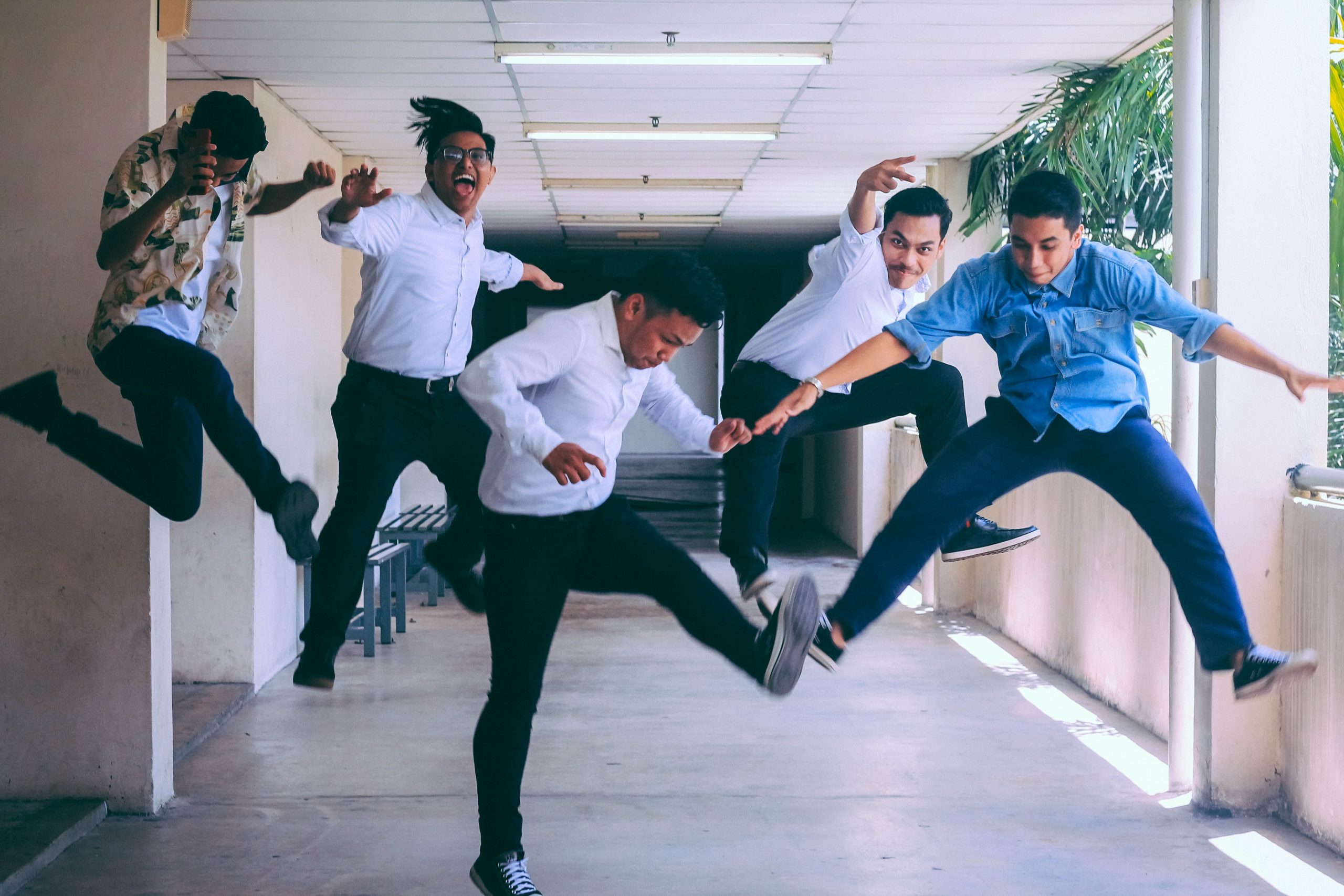 Money team jumping into the air